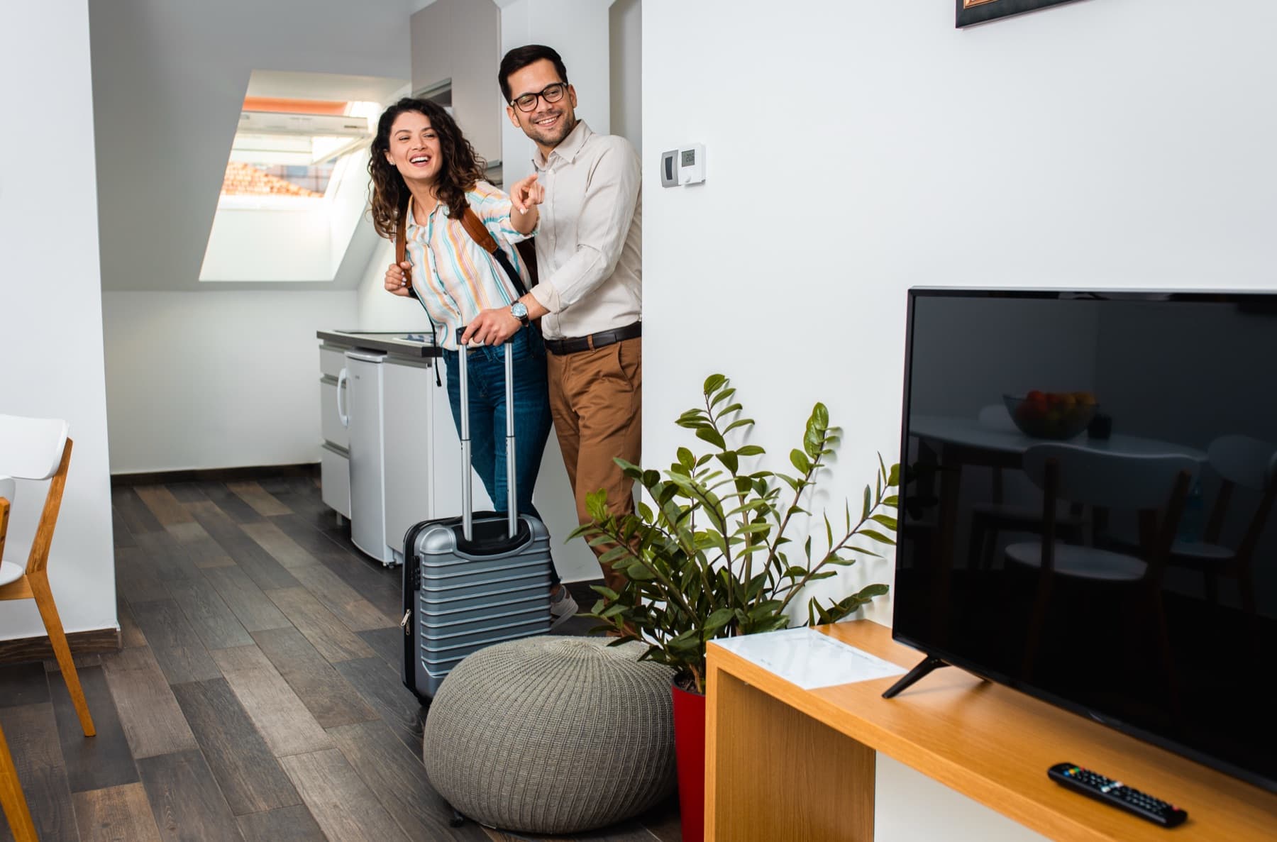 Guests arriving at a rental with their luggage